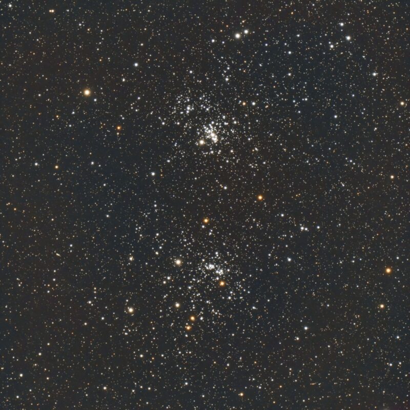 Two large but loose groupings of many bright stars in dense starfield.