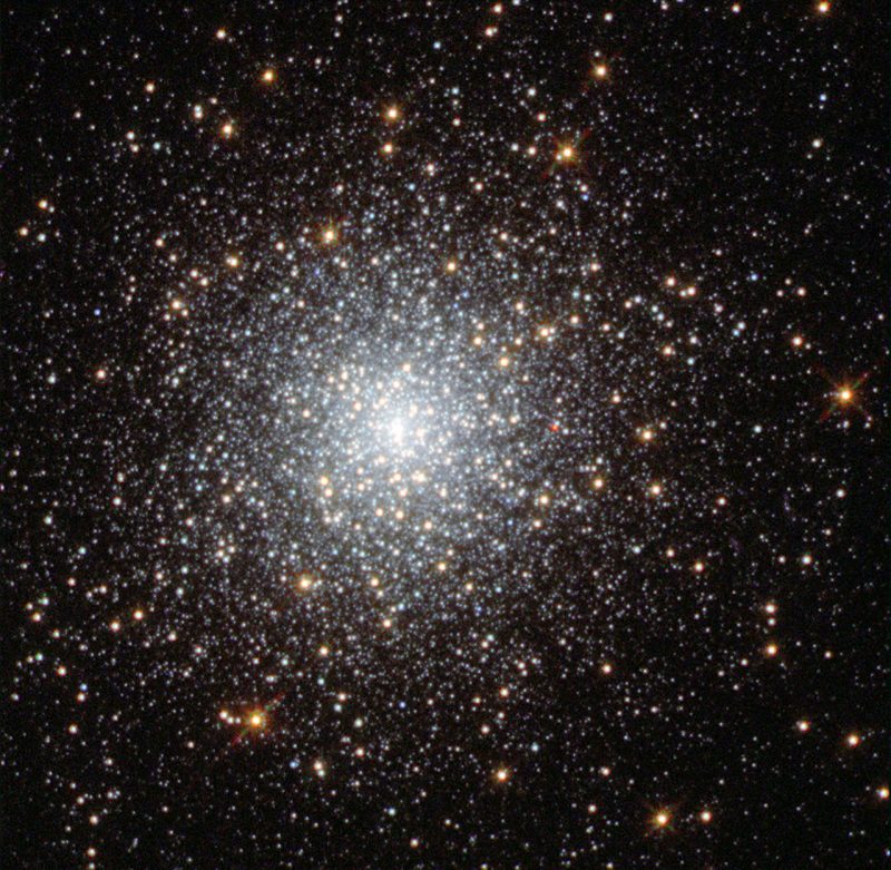 Dense central concentration of bright white stars, becoming more diffuse at the edges.
